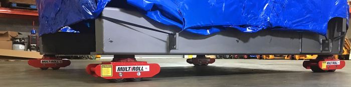 Roller skids for moving heavy equipment use rollers made of